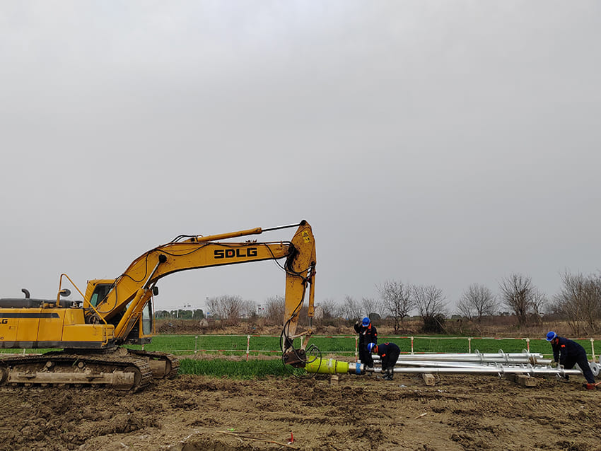 yellow SDLG excavator on dirt ground
